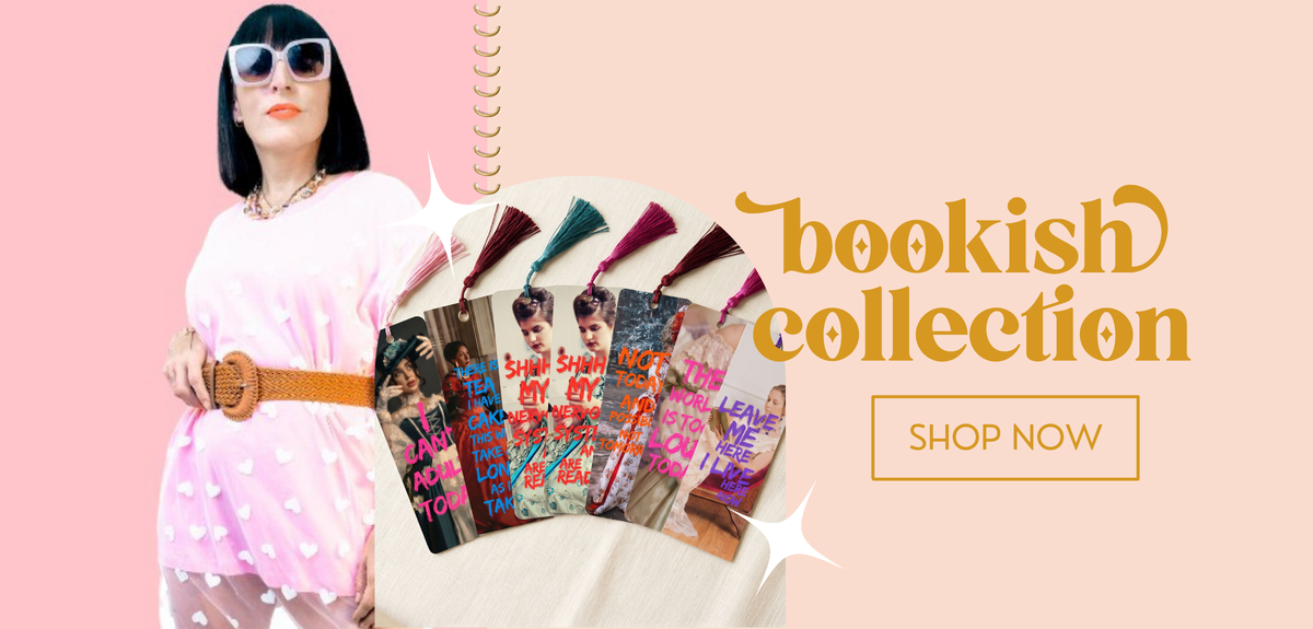 A promotional banner featuring a woman in a pink polka-dot dress and sunglasses holding a fan of colorful book covers, with the text 'bookish collection' and a 'SHOP NOW' button on a peach background.