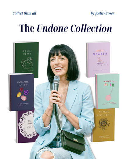 Woman holding a microphone with books titled "The unruly year", 'The Ugly Draft', 'Unbillable Hours', 'Ship it Scared', 'Wreck the Plan' and 'No Muse Required' on a white background.