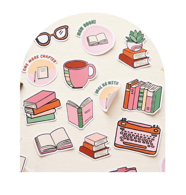 A set of cute, die-cut sticker illustrations featuring book-themed designs such as open books, book stacks, a pink mug, glasses, a typewriter, and a small potted plant, arranged on a light wood surface.